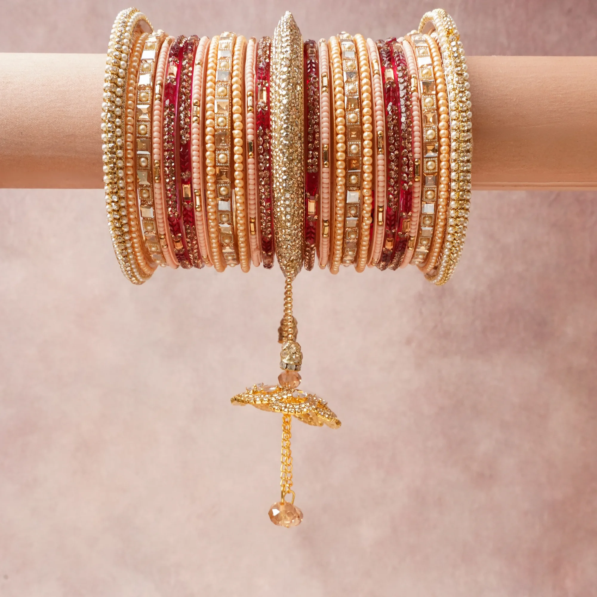 A commanding Golden Peach anchors this beautiful set, enriched with accents of Crimson Red, Cream, Champagne that add depth and dimension.

Featuring a striking composition of Gold-toned Metal Alloy, Simulated Pearls, Glass, Rhinestones, Faceted Glass Crystals, this set carries intricate craftsmanship and strong presence. Grand in form, it is created for moments that deserve to be marked.